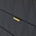 A golden letter slot is embedded in a dark, geometrically patterned wall, suggesting a modern and stylish entrance door or mailbox.