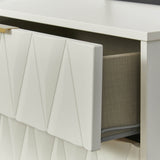 An open white drawer with a geometric pattern partially reveals its gray fabric contents against a white background.