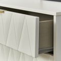 A white textured drawer is partially open, revealing a grey fabric interior with an object inside, against a white background.