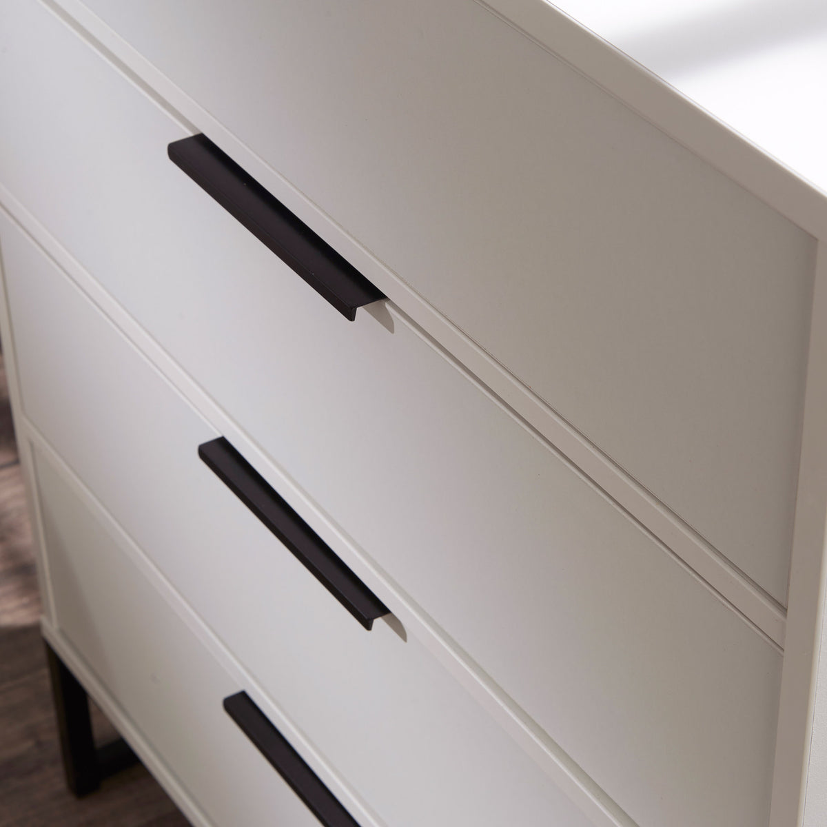Hudson White 4 Drawer Chest with black legs close up
