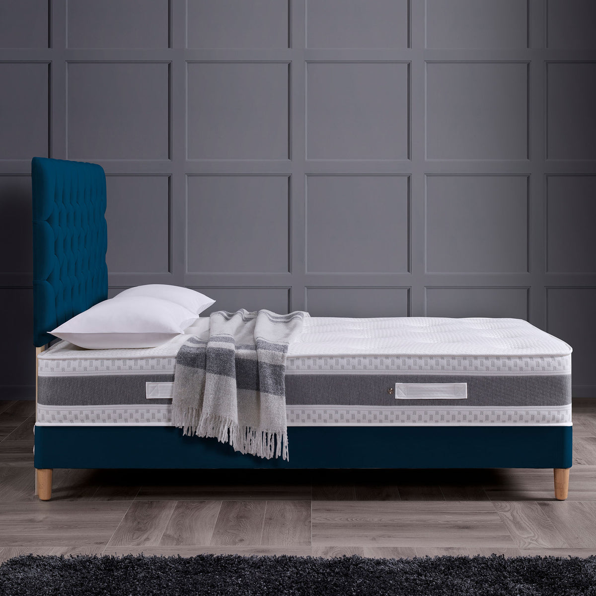 side lifestyle view of the Roseland Sleep Tempest Memory Coil Mattress